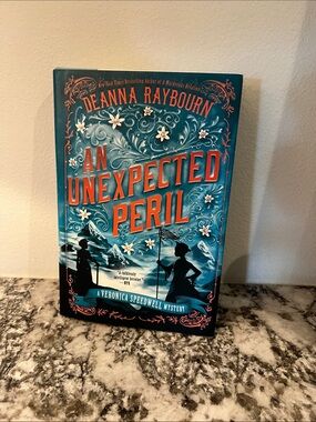 An Unexpected Peril by Deanna Raybourn - Teal & Orange Hardcover